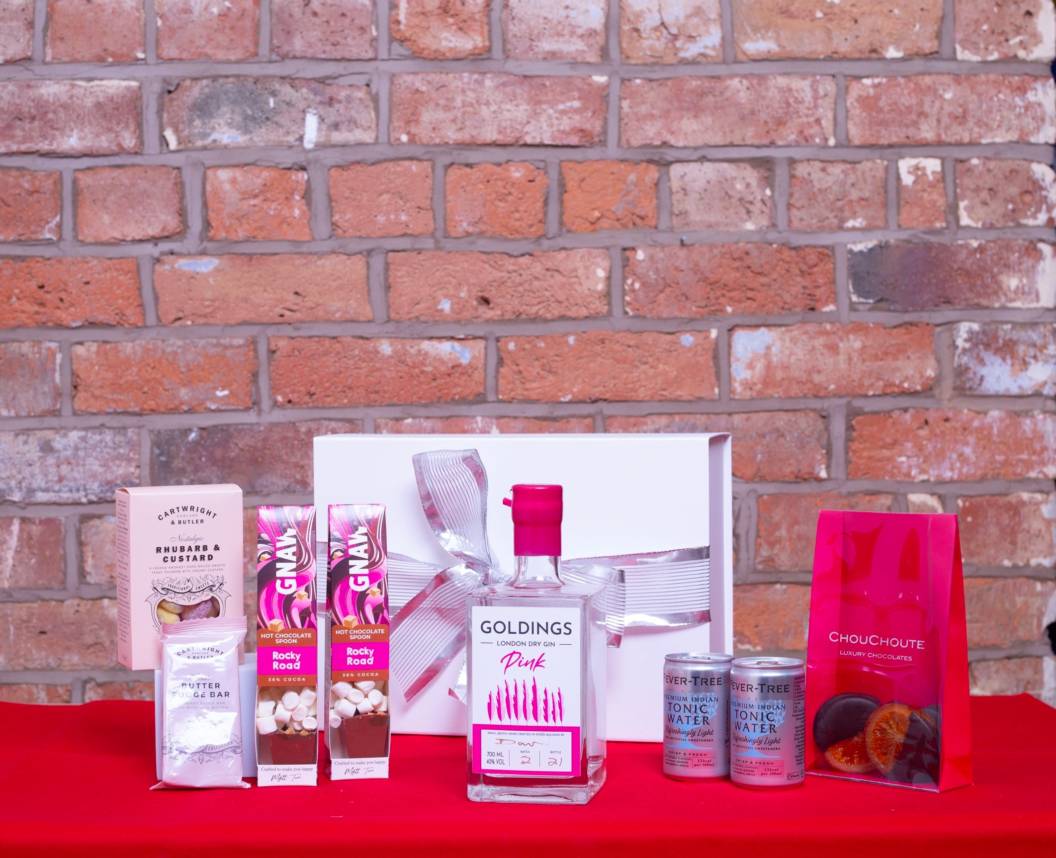 Christmas gift box with gin, tonic, hot chocolate, sweets, fudge, chocolates 